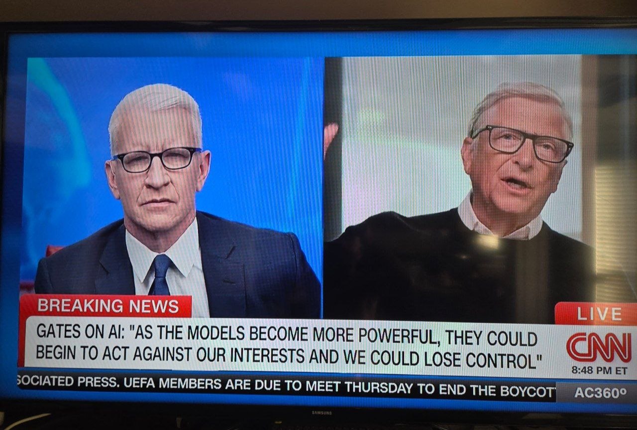 CNN AC360 breaking-news broadcast with Anderson Cooper and Bill Gates on a split screen; the chyron reads "Gates on AI: As the models become more powerful, they could begin to act against our interests and we could lose control."